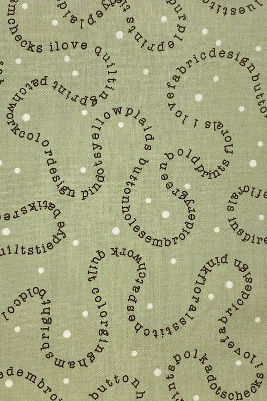 Tessuto Americano Wordplay fondo verde 100% cotone h 110 - 18,00€/mt